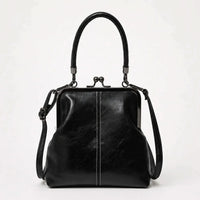 CLASPELLE – Sac bandoulière vintage à fermoir baiser pour un style signature